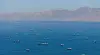 A drone view shows vessels sailing through the Strait of Hormuz, as seen from Musandam, Oman, May 25. [REUTERS/YONHAP]
