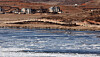 Ice floes drift along the Imjin River near a village in Kaepung County, North Hwanghae Province, North Korea, as seen from the Odusan Unification Observatory in Paju, Gyeonggi, on Feb. 8. [YONHAP]