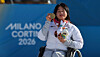 Kim Yun-ji celebrates winning a gold medal at the women's cross-country skiing event at the 2026 Milan-Cortina Winter Paralympics in Italy on March 8. [YONHAP]