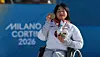 Kim Yun-ji celebrates winning a gold medal at the women's cross-country skiing event at the 2026 Milan-Cortina Winter Paralympics in Italy on March 8. [YONHAP]
