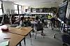 Art teacher Lindsay Johnson, right, teaches students how to ask ChatGPT for help during a summer class at Roosevelt Middle School in River Forest, Illinois, on June 25, 2025. [AP/YONHAP]