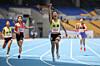 Wang Seo-yoon, a 14-year-old sprinter, second from right, crosses the finish line during the girls’ middle school race at the 55th National Junior Sports Festival at Busan Asiad Main Stadium on May 24. [KOREA ASSOCIATION OF ATHLETICS FEDERATION]