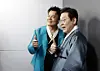 President Lee Jae Myung, right, and JYP Entertainment founder and Co-Chair of the newly established Presidential Committee on Popular Culture Exchange Park Jin-young pose for photos at the K-culture exhibition zone inside Kintex in Goyang, Gyeonggi on Oct. 1, 2025. [JOINT PRESS CORPS]
