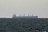 A cargo ship in the Gulf, near the Strait of Hormuz, is seen from northern Ras al-Khaimah, near the border with Oman’s Musandam governance, amid the U.S.-Israeli conflict with Iran, in United Arab Emirates, on March 11. [REUTERS/YONHAP]
