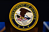 The U.S. Department of Justice logo is seen on a podium before a news conference in Washington May 4. [AP/YONHAP]