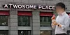 A passerby walks in front of a Twosome Place branch in Seoul on March 24. [YONHAP]