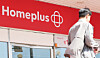 A person walks by a Homeplus branch in downtown Seoul on May 8. [NEWS1]