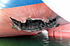 This undated handout photograph released by Korea's Foreign Ministry on May 10 shows a damaged part of the Korean cargo ship HMM Namu docked at a port in Dubai. [YONHAP]