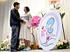 A man and an expecting mother are seen in a photo taken at an event to celebrate day for pregnant in October 2025. [NEWS1]