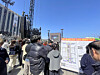 Passersby watch as preparations for boy band BTS's comeback concert in Gwanghwamun Square, to be held on March 21, are underway at the venue in Jongno District, central Seoul, on March 19. [KIM YE-JUNG]