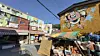 Webtoon characters appear across storefront signboards and walls at Webtoon Ibagu-gil in Beomil-dong, Dong DIstrict, on May 5. [WOO JI-WON]