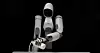 A humanoid robot pours milk. [LOTTE HOTEL]