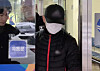 A man who is accused of throwing boiling water on the face of his Thai spouse and causing severe burn injuries is seen at Uijeongbu District Court in Uijeongbu, Gyeonggi, on Dec. 16, 2025. [NEWS1]