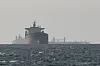 Cargo ships float near the Strait of Hormuz amid the U.S.-Israeli conflict with Iran on March 11. [REUTERS/YONHAP]