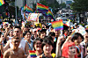 Participants at the Seoul Queer Culture Festival wave rainbow flags and signs as they walk from Jonggak Station in Jongro District, central Seoul, to Euljiro, on June 14, 2025. [YONHAP]
