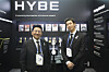 HYBE Chairman Bang Si-hyuk, left, and BTS member RM visit the HYBE promotional booth during the opening ceremony of the APEC CEO Summit at the Gyeongju Arts Center in North Gyeongsang on Oct. 29, 2025. [YONHAP]