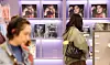 Visitors walk by BTS merch at a store in Jung District, central Seoul, on April 13. [NEWS1]