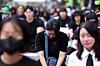 Teachers mourn the death of a fellow teacher at a rally calling for better protection of teachers' rights near the central government complex in central Seoul on June 14, 2025. [YONHAP]