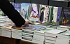 A person picks a book at a bookstore in Seoul on Nov. 13, 2025. [YONHAP]