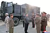 North Korean leader Kim Jong-un, center, oversees the test launch of missiles on April 19 in this photo carried by the state-run Korean Central News Agency a day later. Kim's daughter Ju-ae is also seen in the photo behind him. [YONHAP]