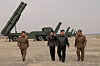North Korean leader Kim Jong-un, second from right, and his daughter Kim Ju-ae attend North Korea's firepower strike drill involving 600-millimeter (24-inch), ultra-precision multiple rocket launchers on March 14 in this photo published by the state-run Rodong Sinmun on March 15. [NEWS1]