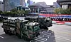 Military trucks carrying South Korea’s Cheongung air defense system travel through central Seoul during a parade.