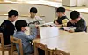 Children read at an elementary school in Gyeonggi on March 6. [NEWS1]