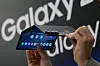 A person holds a Samsung Galaxy Z TriFold smartphone during a launch event at a Samsung store in Seoul on Dec. 2, 2025. [AP PHOTO/YONHAP]
