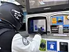 A motorcycle driver presses a panel button to refuel a motorcycle at a self-service gas station in Seongbuk District, central Seoul, on March 9. [KWAK JOO-YOUNG]