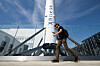 A man walks by a SpaceX Falcon 9 rocket displayed outside a SpaceX facility in Hawthorne, California, on March 26. [AFP/YONHAP]