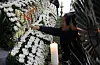 Families and colleagues mourn victims, ask questions at joint memorial ...