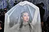 Blackpink's Lisa poses for photos at the 2026 Met Gala celebrating ″Costume Art″ at the Metropolitan Museum of Art in New York on on May 4. [AP/YONHAP]