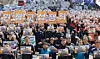 Union members hold placards reading “Secure bargaining with primary contractors” and chant slogans at a rally organized by the Korean Confederation of Trade Unions in Sejong-ro, Seoul, on March 10, the first day of the implementation of the revised Trade Union Act, also known as the “yellow envelope' law. [YONHAP]