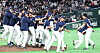 Korean players celebrate the 7-2 win over Australia to reach the knockout round of the World Baseball Classic at the Tokyo Dome in Tokyo on March 9.