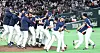 Korean players celebrate the 7-2 win over Australia to reach the knockout round of the World Baseball Classic at the Tokyo Dome in Tokyo on March 9.