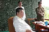 North Korean leader Kim Jong-un oversees a test launch of the new Hwasong-18 solid-fueled intercontinental ballistic missile on July 12, 2023, where an object believed to be a foldable smartphone, shown inside the red circle, was spotted, in this image provided by the Korea Central News Agency. [YONHAP]