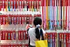 A visitor selects dog leashes at a pet fair held at Coex Magok in Gangseo District, western Seoul, on June 13, 2025. [NEWS1]
