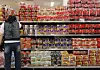 A customer looks at ramyeon displayed in a grocery store in Seoul on March 27. [YONHAP]