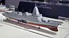 Scale model of the Korea Destroyer Next Generation displayed on a white platform at an exhibition.