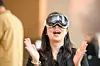 A customer tries on Apple Vision Pro, Apple’s mixed-reality headset, at an Apple Store in Myeongdong, Jung District, central Seoul, on Nov. 15, 2024. [YONHAP]