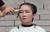 Independent lawmaker Lee Un-ju shaves her head after holding a press conference in front of the National Assembly in Yeouido, western Seoul, on Sept. 10, 2019, to call for the withdrawal of then-Justice Minister Cho Kuk's appointment and an official apology to the public. [YONHAP]