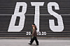 People walk by BTS's promotional installation for its upcoming album 'Arirang' in central Seoul on Jan. 15. [AP/YONHAP]
