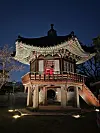 A daegeum player performs inside a pavilion at Nakseonjae's rear garden. [JIN EUN-SOO]
