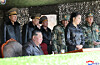 North Korean leader Kim Jong-un, front row left, and his daughter Kim Ju-ae oversee a coordinated offensive tactical drill of infantrymen's and tankmen's subunits on March 19, at the Pyongyang Training Base No. 60 under the Capital City Defence Corps of the Korean People's Army, in this photo released by the Korean Central News Agency on March 20. [YONHAP]