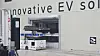 A machine at Pit In's facility moves EV batteries into charging systems. [LEE SOO-JUNG]