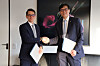 Bank of Korea Gov. Rhee Chang-yong, right, and Martin Schlegel, chairman of the governing board of the Swiss National Bank, pose for a photo after renewing a currency swap agreement at the headquarters of the Bank for International Settlements in Basel, Switzerland, on March 9. [BOK]