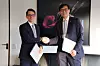 Bank of Korea Gov. Rhee Chang-yong, right, and Martin Schlegel, chairman of the governing board of the Swiss National Bank, pose for a photo after renewing a currency swap agreement at the headquarters of the Bank for International Settlements in Basel, Switzerland, on March 9. [BOK]