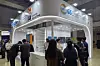 Visitors to GS Entec's booth at World Smart Energy Week 2026 are seen looking around video displays at an exhibition hall in Tokyo on March 19. [GS ENTEC]