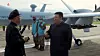 North Korean leader Kim Jong-un, right, oversees an unmanned aerial vehicle, dubbed ″Saetbyol-9,″ in a footage disclosed by the regime-controlled Korean Central Television on January 2024. [KOREAN CENTRAL TELEVISION/YONHAP]