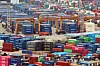 Trade containers are stacked at a container terminal in Busan on June 1. [YONHAP]